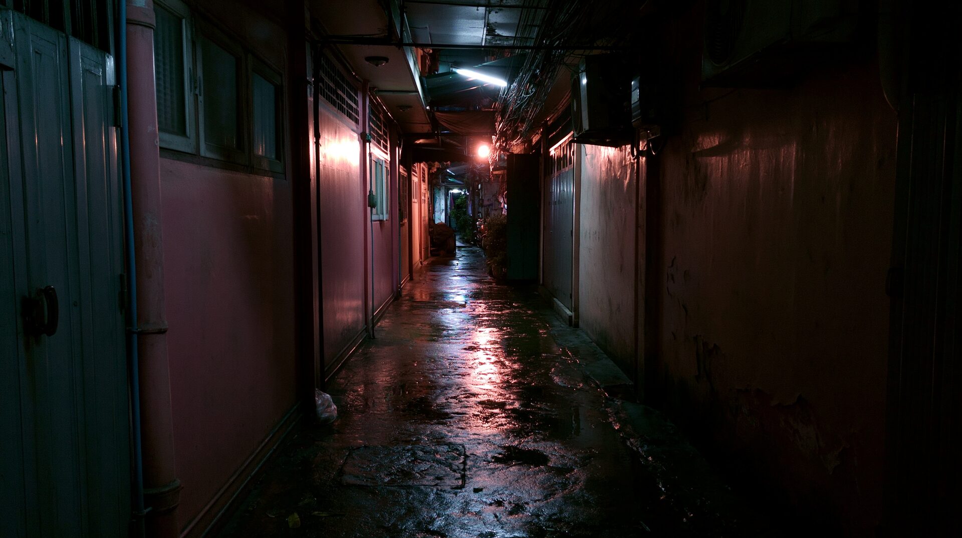 a tight soi alley, wet and dark, inside 4AM Bangkok